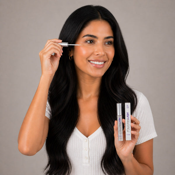 FOLIGAIN® LASH Eyelash Volumizer serum bottle with applicator for enhancing eyelash length and fullness.