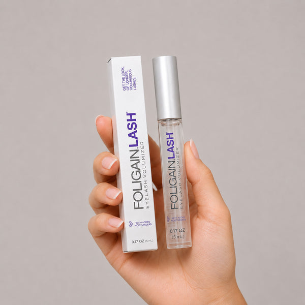 FOLIGAIN® LASH Eyelash Volumizer serum in a sleek bottle, designed to enhance eyelash fullness and length.