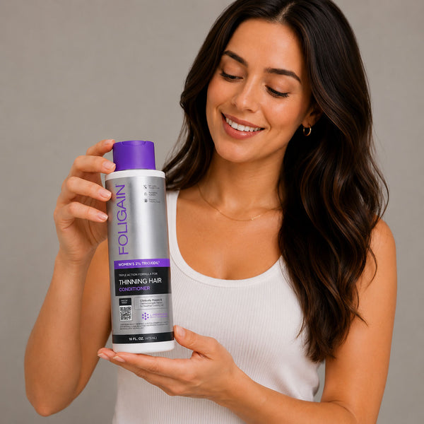FOLIGAIN Triple Action Conditioner for Women with 2% TRIOXIDIL, thinning hair treatment, 473ml bottle, side view.