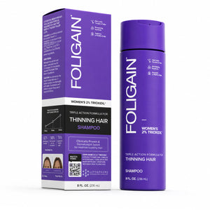 FOLIGAIN Triple Action Shampoo for thinning hair in women, featuring 2% TRIOXIDIL®, shown in a clear bottle with label.