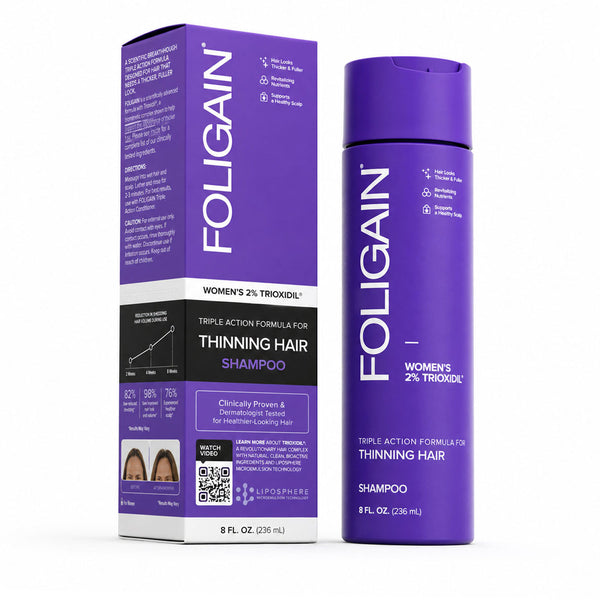 FOLIGAIN Triple Action Shampoo for thinning hair in women, featuring 2% TRIOXIDIL®, shown in a clear bottle with label.