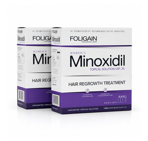 FOLIGAIN Canada Minoxidil 2% hair regrowth treatment topical lotion for women, 6-month supply, bottle of clear liquid.